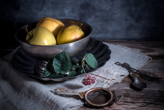 Still life with melchior bowl, apples and vintage cutlery
