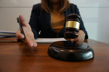 Legal counsel presents to the client a signed contract with gavel and legal law. justice and lawyer law of advisor Concepts