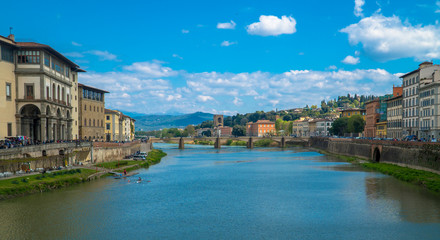 Fototapeta na wymiar Florence, Tuscany / Italy: River Arno seen from Ponte Vecchio with the Uffizi Gallery on the left