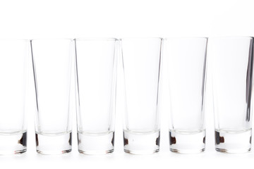  small empty glasses on a white background