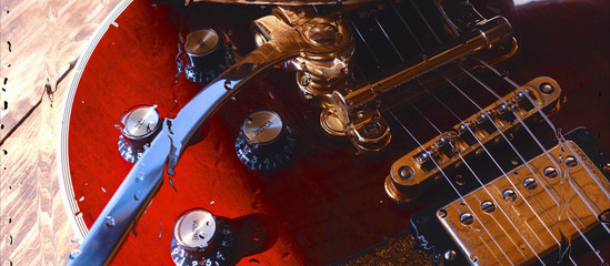 electric guitar behind the glass with water drops . closeup