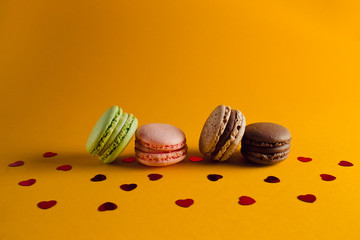macaroon arranged in beautiful composition on a  yellow background