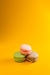 macaroon arranged in beautiful composition on a  yellow background