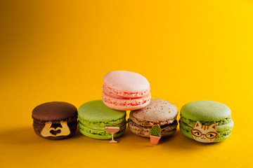 macaroon arranged in beautiful composition on a  yellow background