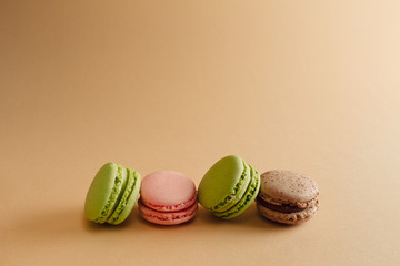 macaron arranged in beautiful composition on a pink background