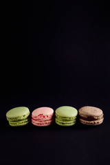 macaroon arranged in beautiful composition on a black background