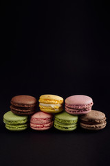 macaroon arranged in beautiful composition on a black background