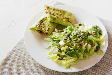 fresh vegetarian breakfast with salad and pita bread roll and cheese
