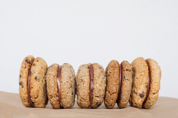 Delicious hazelnut and almond sandwich biscuits with chocolate, ganache and gianduja filling. Baci di dama (Lady's kisses) - italian cookies from Piedmont.
