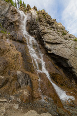 Waterfall in Altay mountains. Beautiful nature landscape. Popular touristic distination.