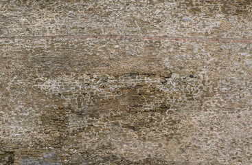 Texture of ancient ruined stone wall