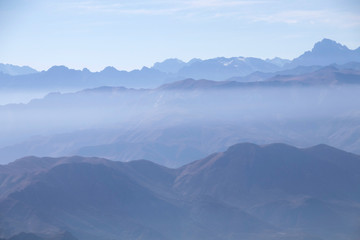 Misty blue Andean mountain landscape background