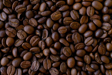 Background made of coffee beans, top view for copy space