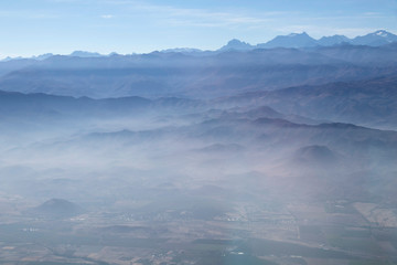 Misty blue Andean mountain landscape background