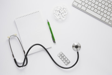 Flat lay medical composition with notepad tempalte