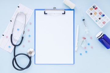 Flat lay medical composition with clipboard template