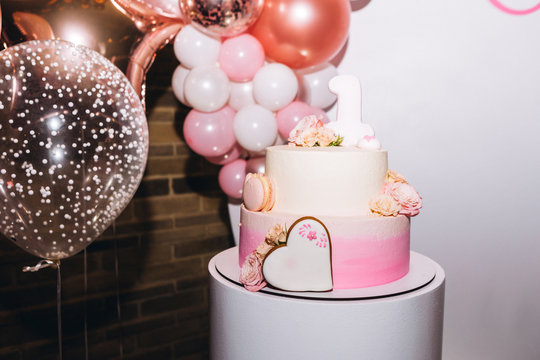 photo of a birthday party with cake and balls