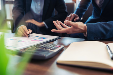 business people and coworker colleagues discussing explanations about week working plan project cooperating in modern coworking office.