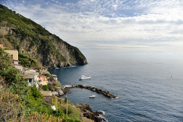 Riomaggiore - Village of Cinque Terre National Park at Coast of Italy. Beautiful colors at sunset. Province of La Spezia, Liguria, in the north of Italy - Travel destination and attractions in Europe.