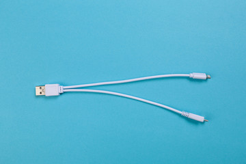 USB Micro cables ob blue background. Connectors and sockets for PC and mobile devices- Image