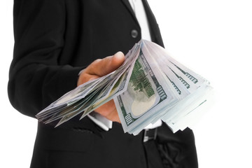 Business man holding money on white background