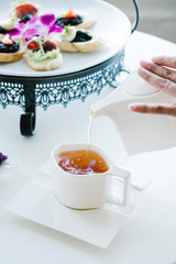 girl pour tea slowly