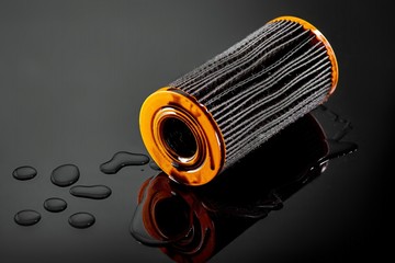 car engine oil filter on dark background
