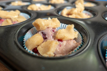 raw muffin dough with crumble before baking