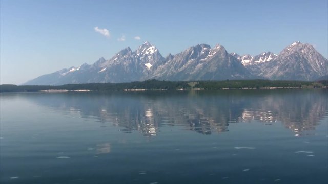 Mountain View with reflection in the water Sailing shot in the Lake, Grand Teton