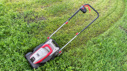 lawn mower on freshly cut grass