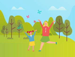 Mother and daughter on lawn catching butterflies in green park. Happy woman and girl spend time together outdoors, green trees and bushes, spring time