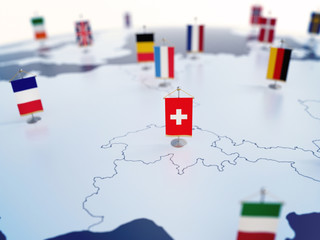 Flag of Switzerland in focus among other European countries flags. Europe marked with table flags...