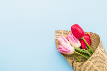 Bouquet of bright fresh flowers in craft paper
