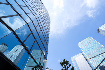 Skyscraper with reflection of sky in Nagoya, Japan.