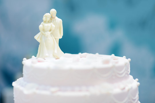 Beautiful Wedding Cake With Figurines From White Chocolate On Top