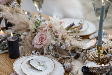 Sea wedding decor on the coast. Evening wedding ceremony near the water