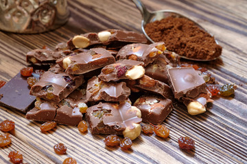 chocolate with nuts on wooden background