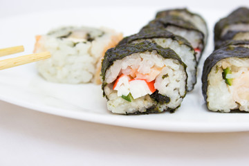 Japanese cuisine, rice sushi and fish - closeup