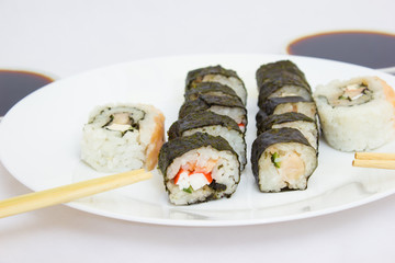 Japanese cuisine, rice sushi and fish - closeup