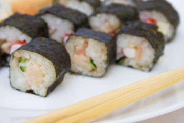 Japanese cuisine, rice sushi and fish - closeup