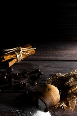 Small barrel with sugar on a wooden background