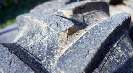 Close-up of tractor tyre texture detail. Heavy machinery.