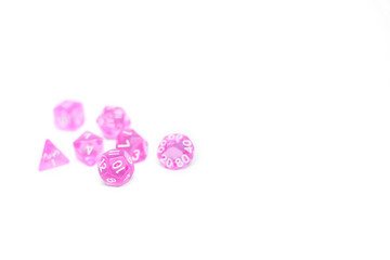Obraz na płótnie Canvas Pink dices for fantasy dnd and rpg tabletop games. Board game polyhedral dices with different sides isolated on white background