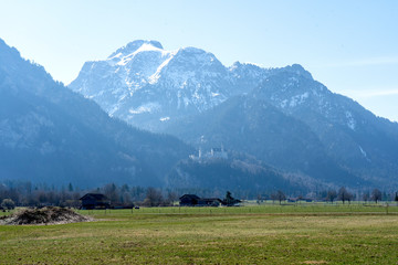 Neuschwanstein castle in Bavaria, Germany - April 3, 2019: Famous castle Neuschwanstein near Alpsee and Nohenschwangau in Bavarian alps. Bayern (Bavaria), Germany.