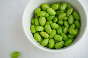 Edamame beans on bowl on a table
