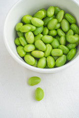 Edamame beans on bowl on a table