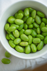 Macro image of edamame beans on bowl on a table