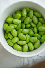 Macro image of edamame beans on bowl on a table