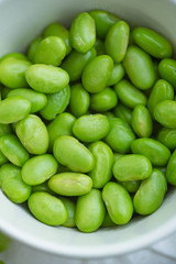 Macro image of edamame beans on bowl on a table