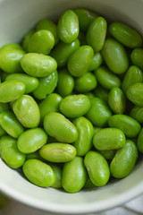 Macro image of edamame beans on bowl on a table